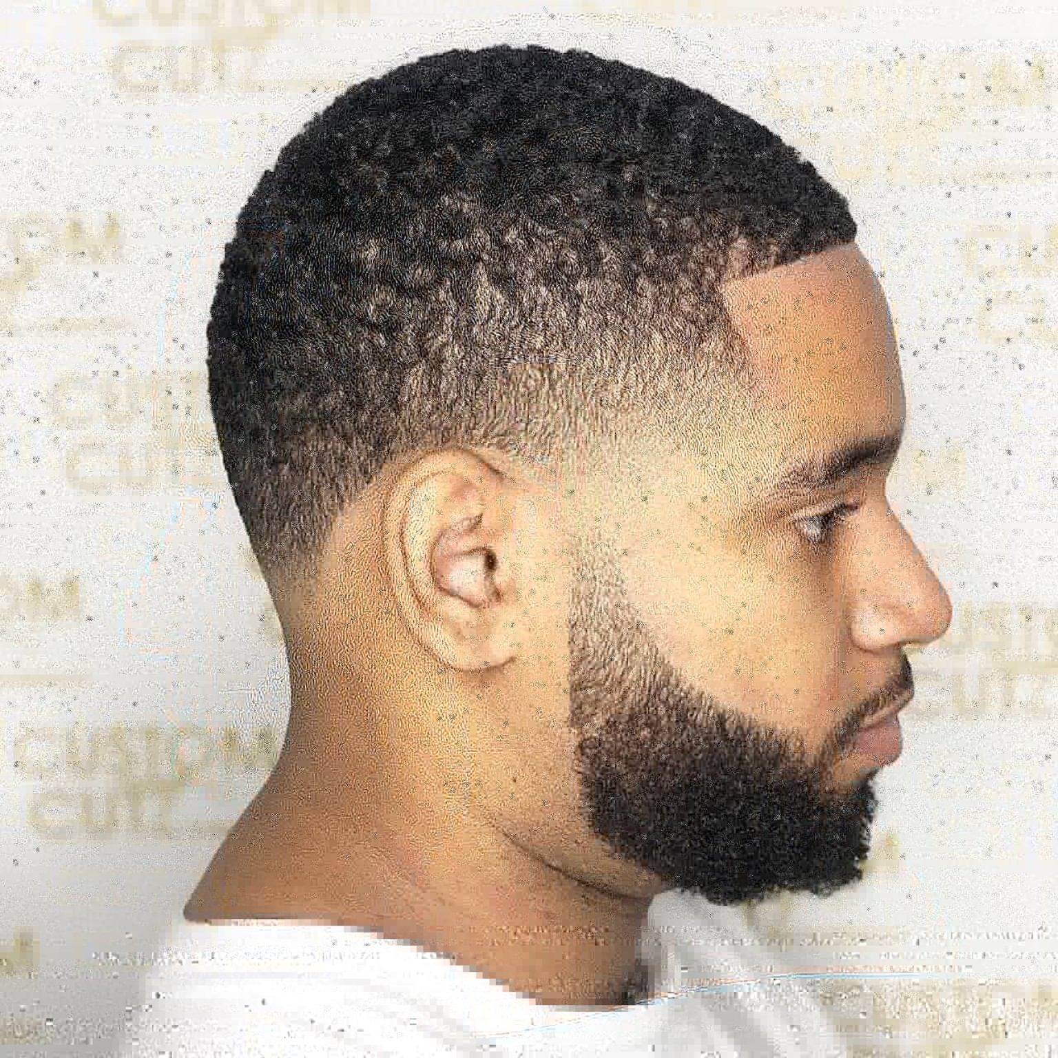 Short textured top with a fade and beard