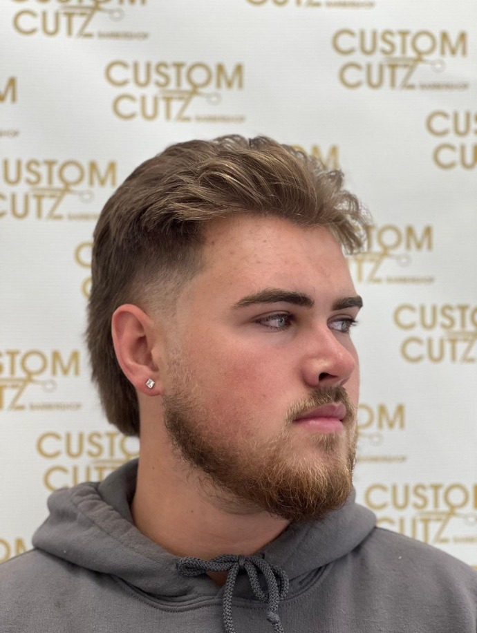 Light-brown textured top with a faded side and full beard